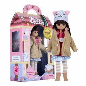 Pandora Lottie Doll standing beside manufacturer's packaging.