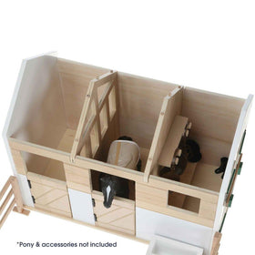 View from above of Lottie doll stable block showing 3 stalls for horses.