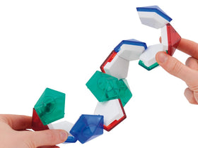 Two hands stretching out the Mind Jewel puzzle.