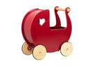 Red wooden Moover pram on light background.