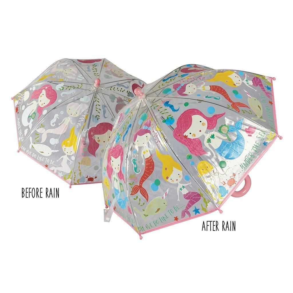 Two umbrellas patterned with mermaids - one showing the pattern when chaged due to the rain.