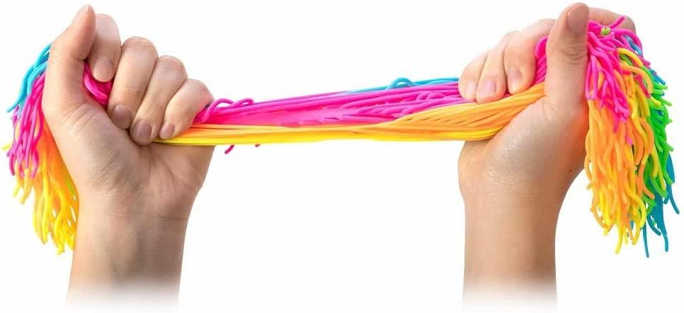 Hands pulling the colourful, stretchy toy noodles.