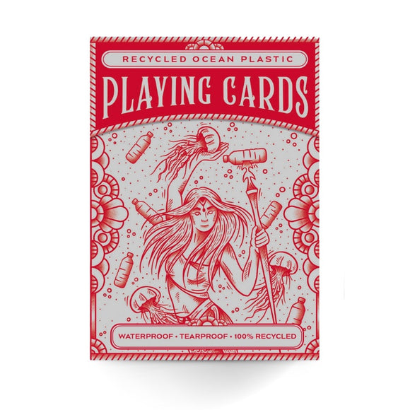 Introducing the Ocean Plastic Playing Cards by Big Potato Games. This red box showcases an illustration of a woman with a trident amidst ocean waves and floating plastic bottles. The text highlights "Eco-Friendly Playing Cards" and "Waterproof - Tearproof," underscoring its design from 100% recycled ocean plastic.