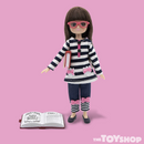 Pink background with Story Time Lottie in her blue and white striped outfit holding a book under her arm and another lying open in front of her.