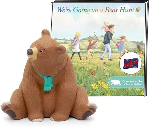 Figure of a seated brown bear character wearing a green scarf from the book 'We're Going on a Bear Hunt'.