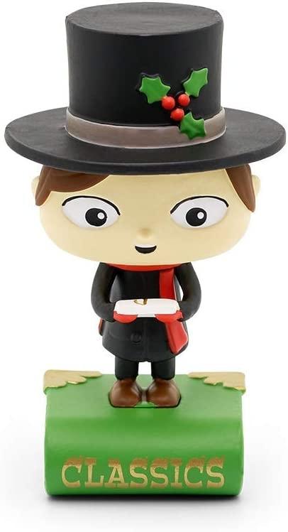 Tiny Tim figure wearing black clothes and a large black top hat standing on a green book with the word 'Classics'.