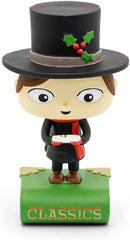 Tiny Tim figure wearing black clothes and a large black top hat standing on a green book with the word 'Classics'.