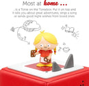 Gretel figure from the Hansel and gretel Tonie. She is wearing a red dresss, yellow hair and standing on top of  a Toniebox.