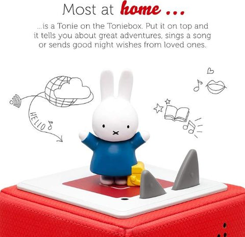 White Miffy rabbit figure wearing a long-sleev blue dress atop a red Toniebox.