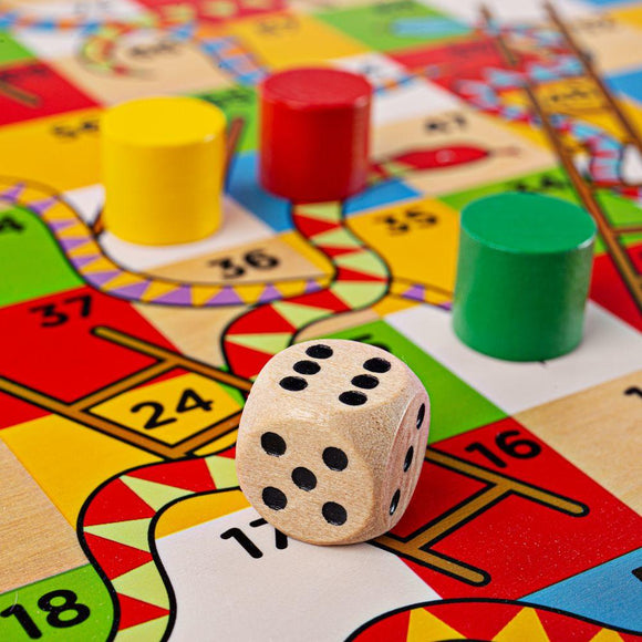 Close-up view of the corner of the wooden snales and ladders game.