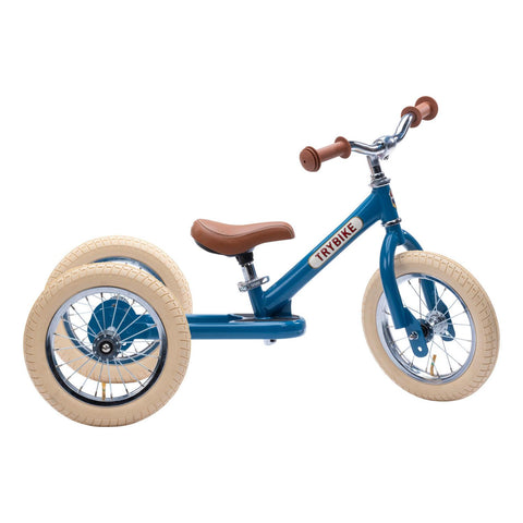 Blue Trybike in profile on a white background.