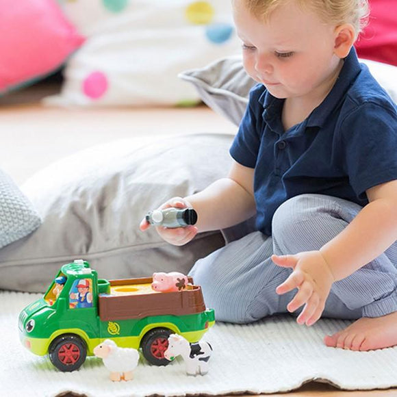 Child playing with farmer's truck.
